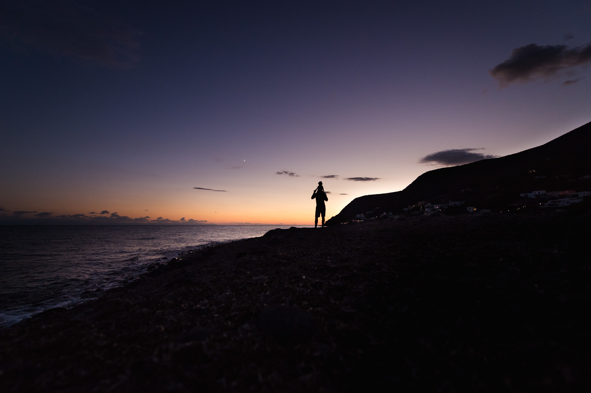 Along horizon and shoreline to subjects.